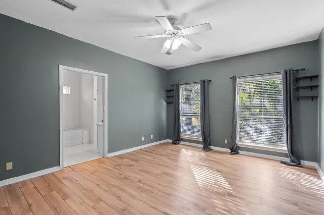a view of a room with a ceiling fan