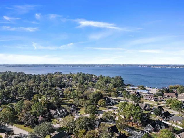 an aerial view of residential building and trees