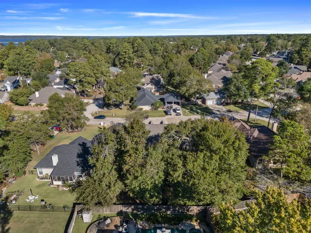 a view of an empty room with closet and a window