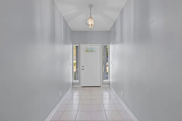 a kitchen with a sink stove and refrigerator