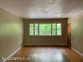 2117 Spring Park Road, Unit 4 Jacksonville, FL 32207 - Photo 6 of 9 a view of an empty room with a window