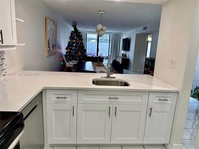 a bathroom with a sink vanity and a mirror