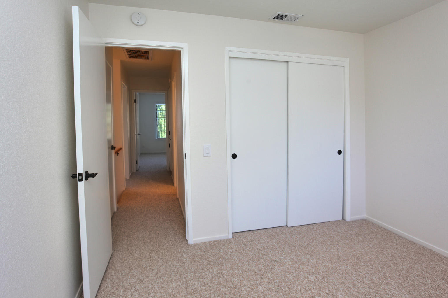 1493 Aarhus Drive, Unit 7 Solvang, CA 93463 - Photo 14 of 24 a view of an empty room with a hallway
