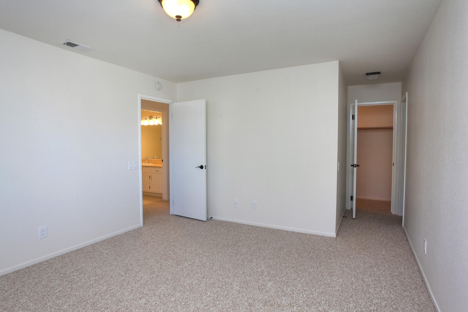 1493 Aarhus Drive, Unit 7 Solvang, CA 93463 - Photo 16 of 24 a view of an empty room with closet and a window