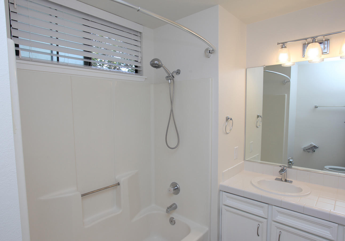 1493 Aarhus Drive, Unit 7 Solvang, CA 93463 - Photo 19 of 24 a bathroom with a granite countertop sink a toilet and shower