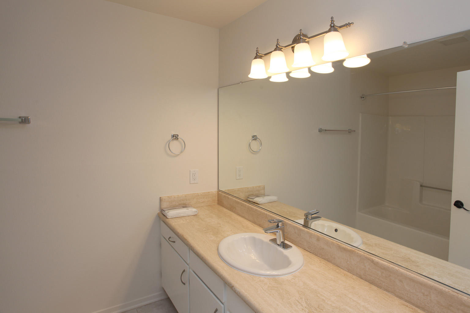 1493 Aarhus Drive, Unit 7 Solvang, CA 93463 - Photo 20 of 24 a bathroom with a sink and a mirror