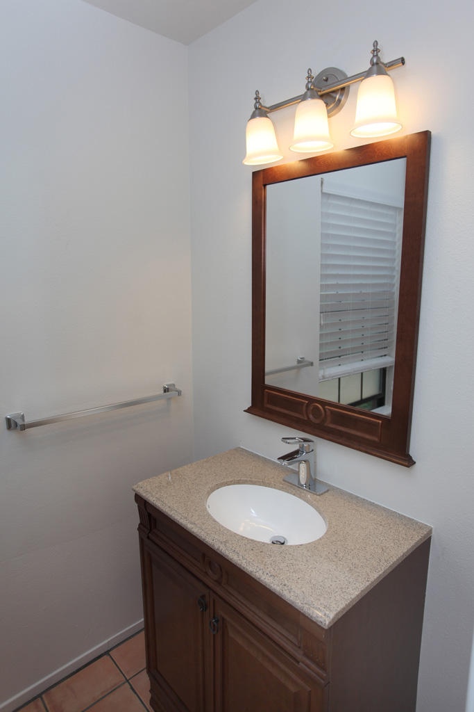 1493 Aarhus Drive, Unit 7 Solvang, CA 93463 - Photo 22 of 24 a bathroom with a sink vanity and mirror