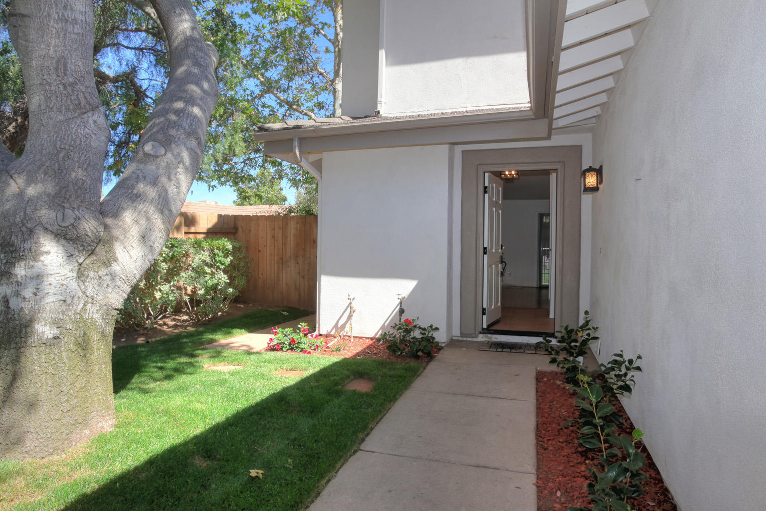 1493 Aarhus Drive, Unit 7 Solvang, CA 93463 - Photo 3 of 24 a backyard of a house with lots of green space