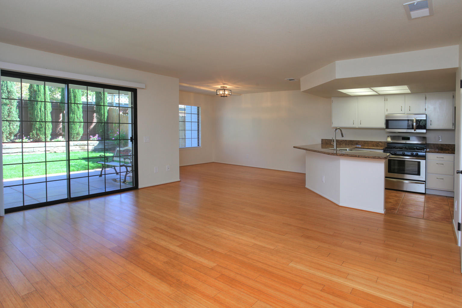 1493 Aarhus Drive, Unit 7 Solvang, CA 93463 - Photo 5 of 24 a kitchen with stainless steel appliances granite countertop a stove top oven and sink