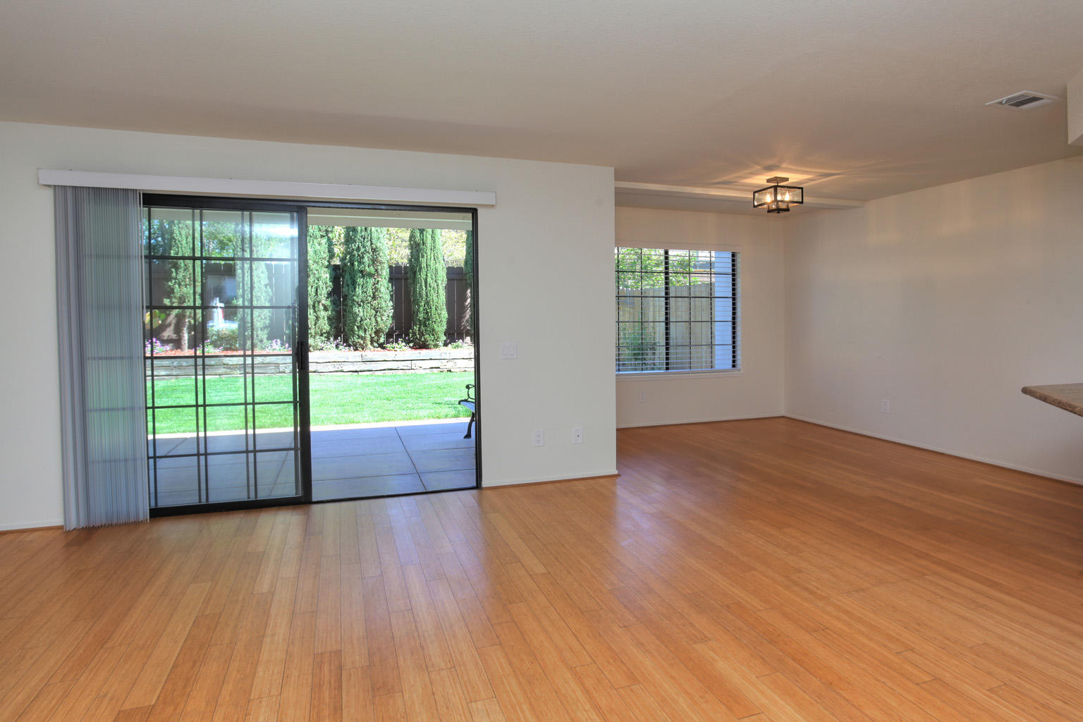 1493 Aarhus Drive, Unit 7 Solvang, CA 93463 - Photo 6 of 24 a view of empty room with wooden floor and fan