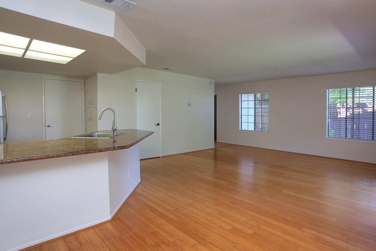 1493 Aarhus Drive, Unit 7 Solvang, CA 93463 - Photo 9 of 24 a view of kitchen and hall with wooden floor