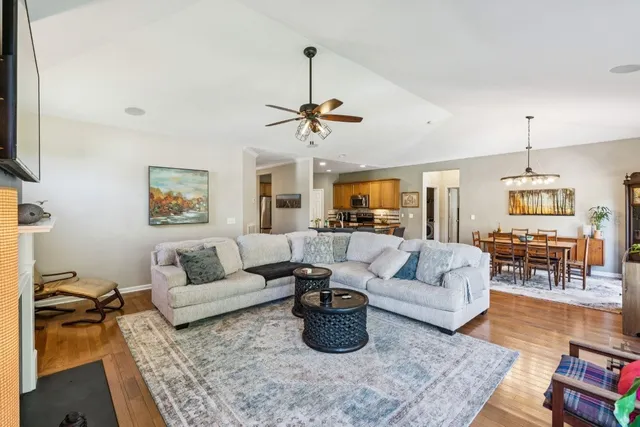 a living room with furniture or couch and a ceiling fan