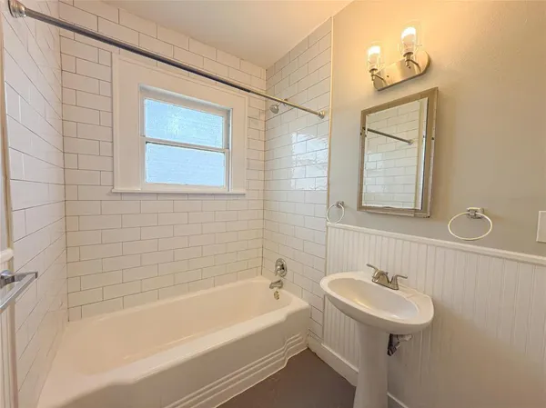 a bathroom with a sink and a bathtub