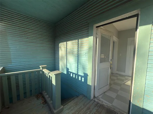 a view of balcony with furniture