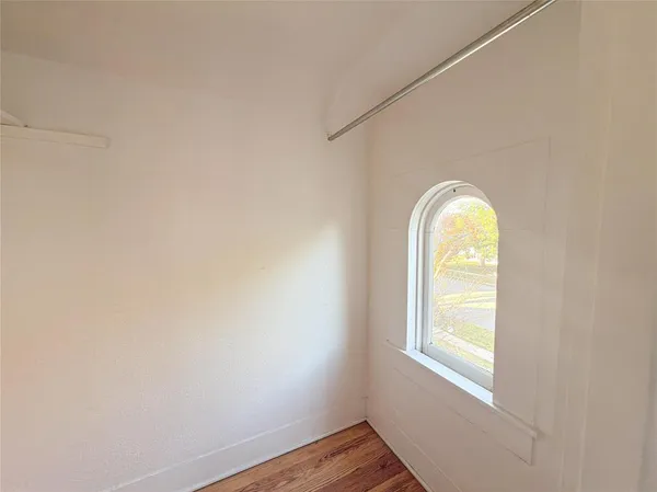 a view of a room that has a window in it
