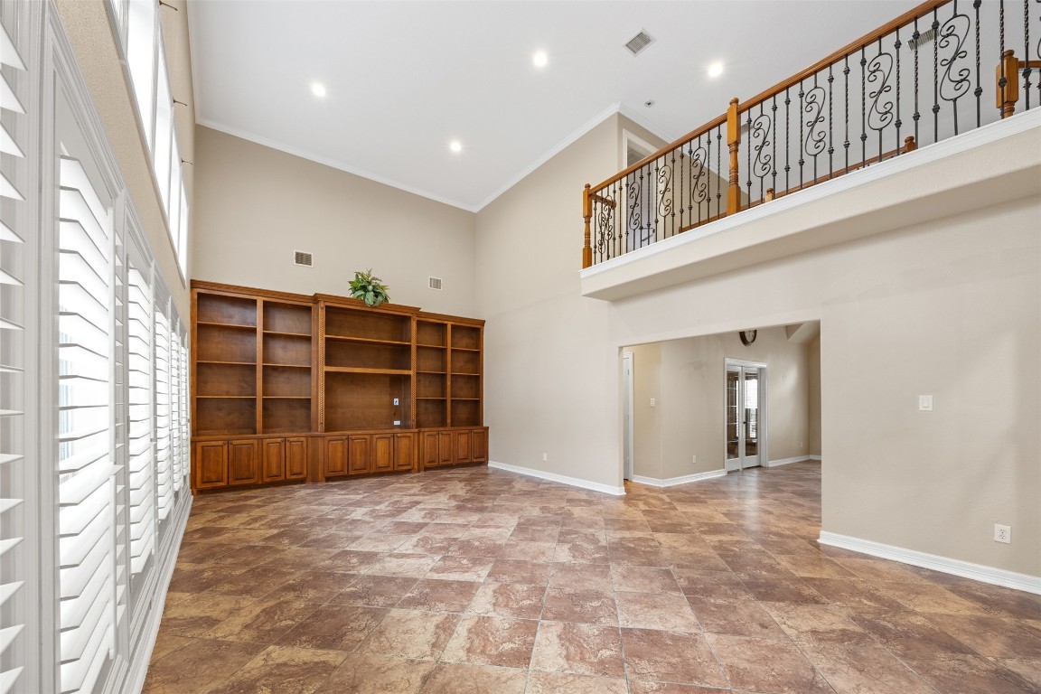 2622 Muegge Road Rosenberg, TX 77471 - Photo 18 of 35 a view of an empty room with a walk in closet and wooden floor