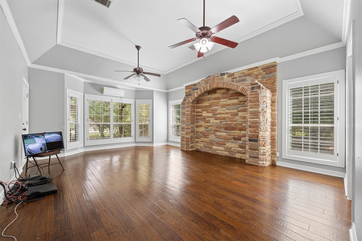 2622 Muegge Road Rosenberg, TX 77471 - Photo 19 of 35 wooden floor in an empty room with a window