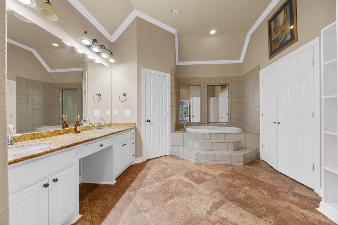 2622 Muegge Road Rosenberg, TX 77471 - Photo 21 of 35 a large bathroom with a sink a large mirror and shower