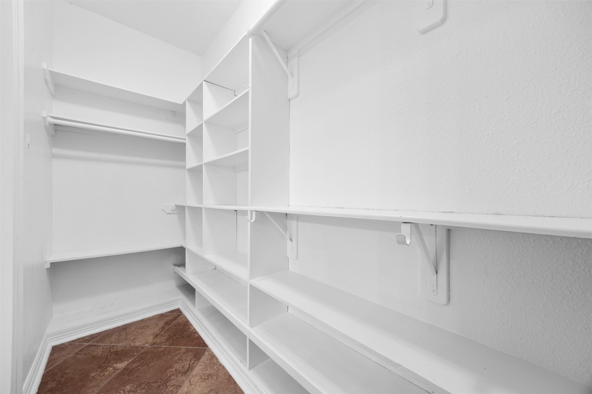 2622 Muegge Road Rosenberg, TX 77471 - Photo 23 of 35 a view of walk in closet with empty racks