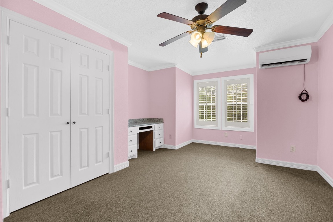 2622 Muegge Road Rosenberg, TX 77471 - Photo 29 of 35 a view of a livingroom with a ceiling fan a ceiling fan and a window