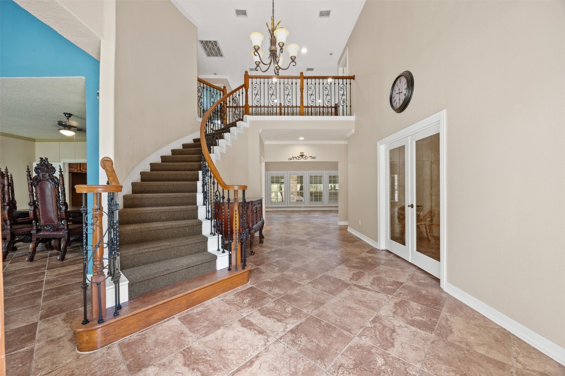 2622 Muegge Road Rosenberg, TX 77471 - Photo 5 of 35 a view of entryway and hall with a chandelier