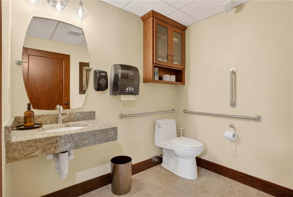 750 Washington Road Pittsburgh, PA 15228 - Photo 15 of 45 a bathroom with a toilet sink and mirror