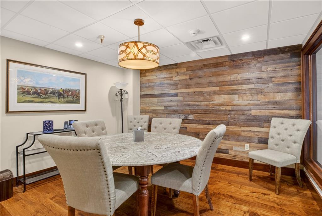 750 Washington Road Pittsburgh, PA 15228 - Photo 18 of 45 a view of a dining room with furniture wooden floor and chandelier