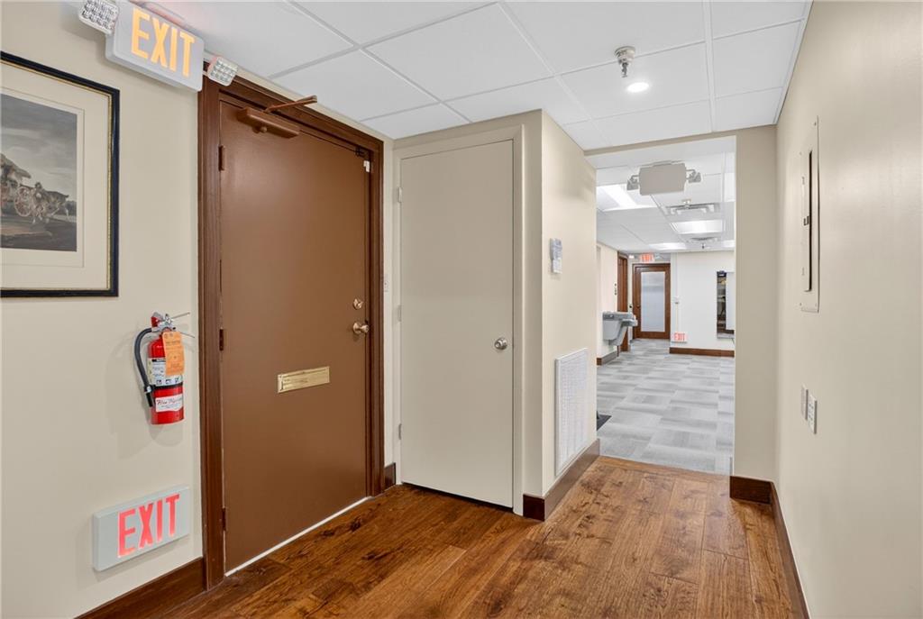 750 Washington Road Pittsburgh, PA 15228 - Photo 24 of 45 a view of a hallway with wooden floor and closet