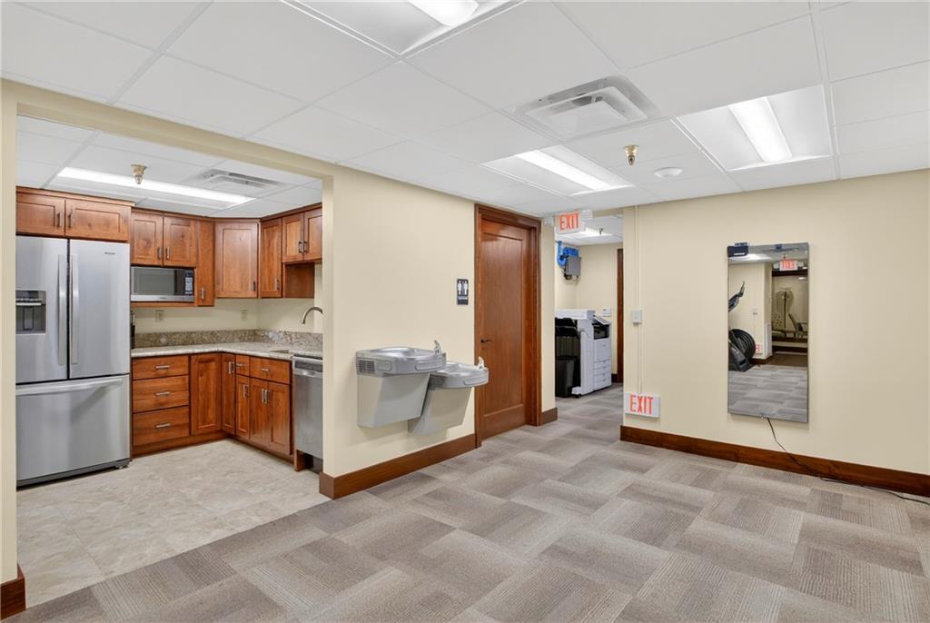 750 Washington Road Pittsburgh, PA 15228 - Photo 26 of 45 a large white kitchen with a refrigerator and a sink