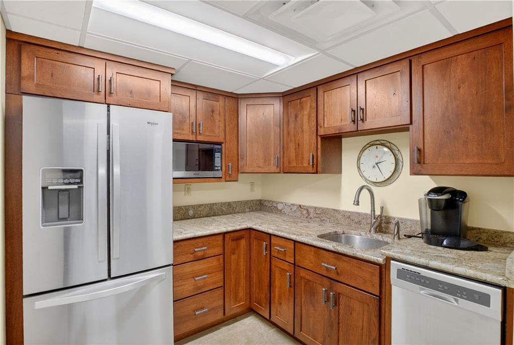 750 Washington Road Pittsburgh, PA 15228 - Photo 27 of 45 a kitchen with granite countertop stainless steel appliances a refrigerator a sink and cabinets