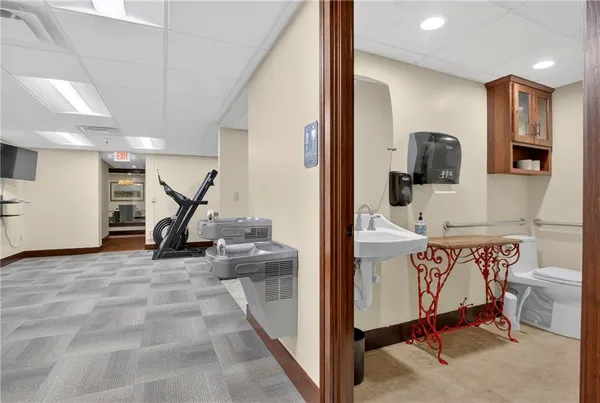 a view of a hallway with seating area