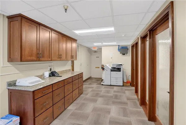 a spacious bathroom with a sink double vanity and a mirror