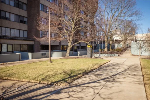a swimming pool with outdoor seating