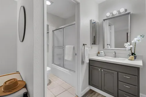 a white toilet sitting next to a bathroom