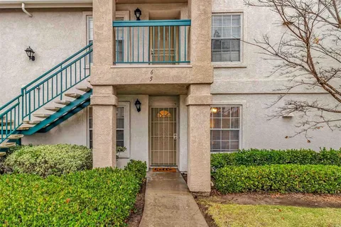 a view of a house with wooden stairs