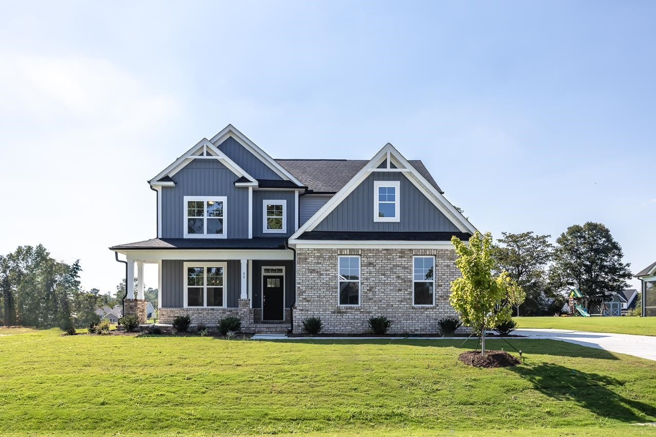 82 Morningside Lane Angier, NC 27501 - Photo 1 of 28 a front view of a house with a yard