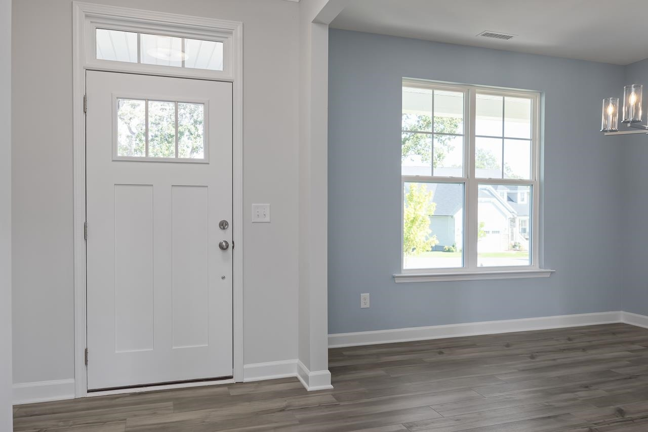 82 Morningside Lane Angier, NC 27501 - Photo 2 of 28 an empty room with wooden floor closet and windows