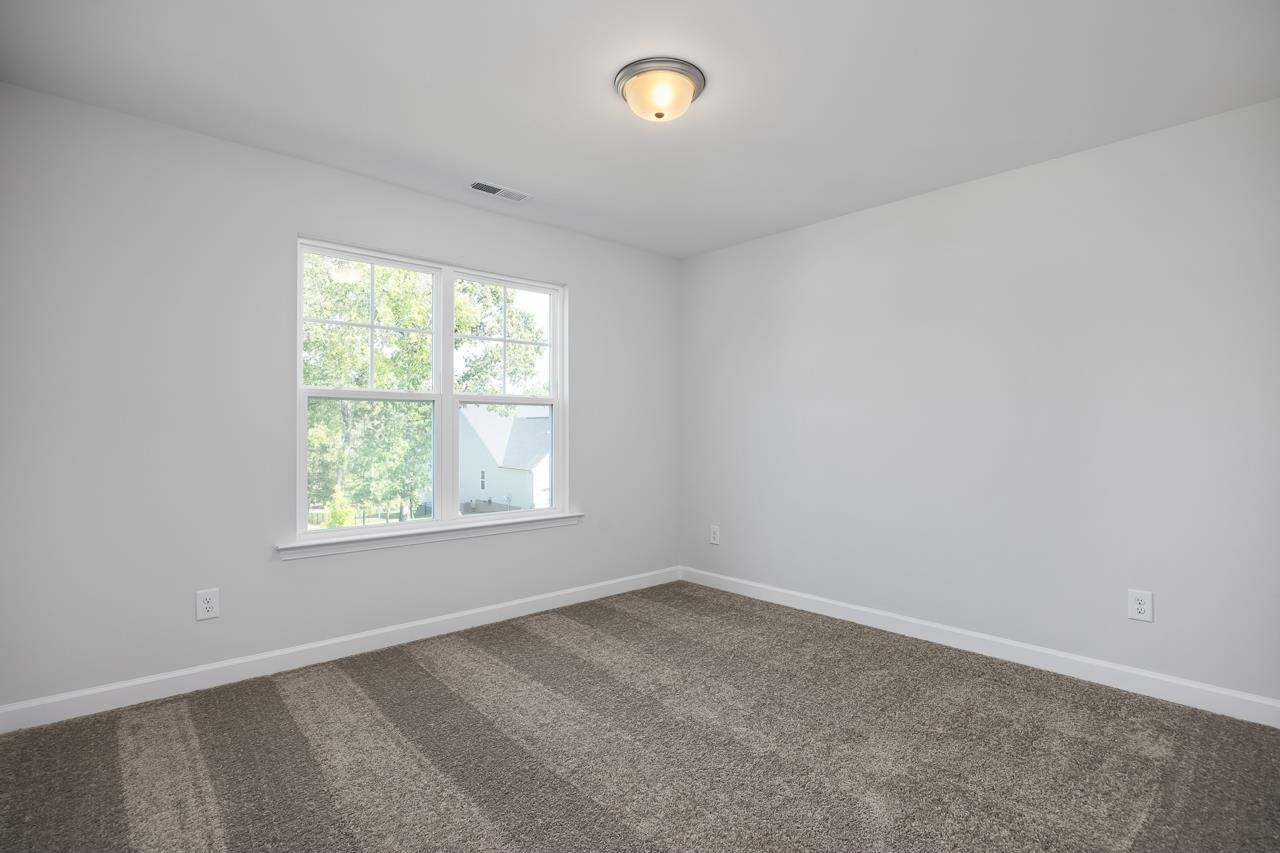 82 Morningside Lane Angier, NC 27501 - Photo 25 of 28 an empty room with a window