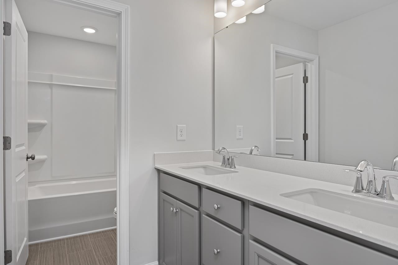 82 Morningside Lane Angier, NC 27501 - Photo 27 of 28 a bathroom with a sink and a mirror