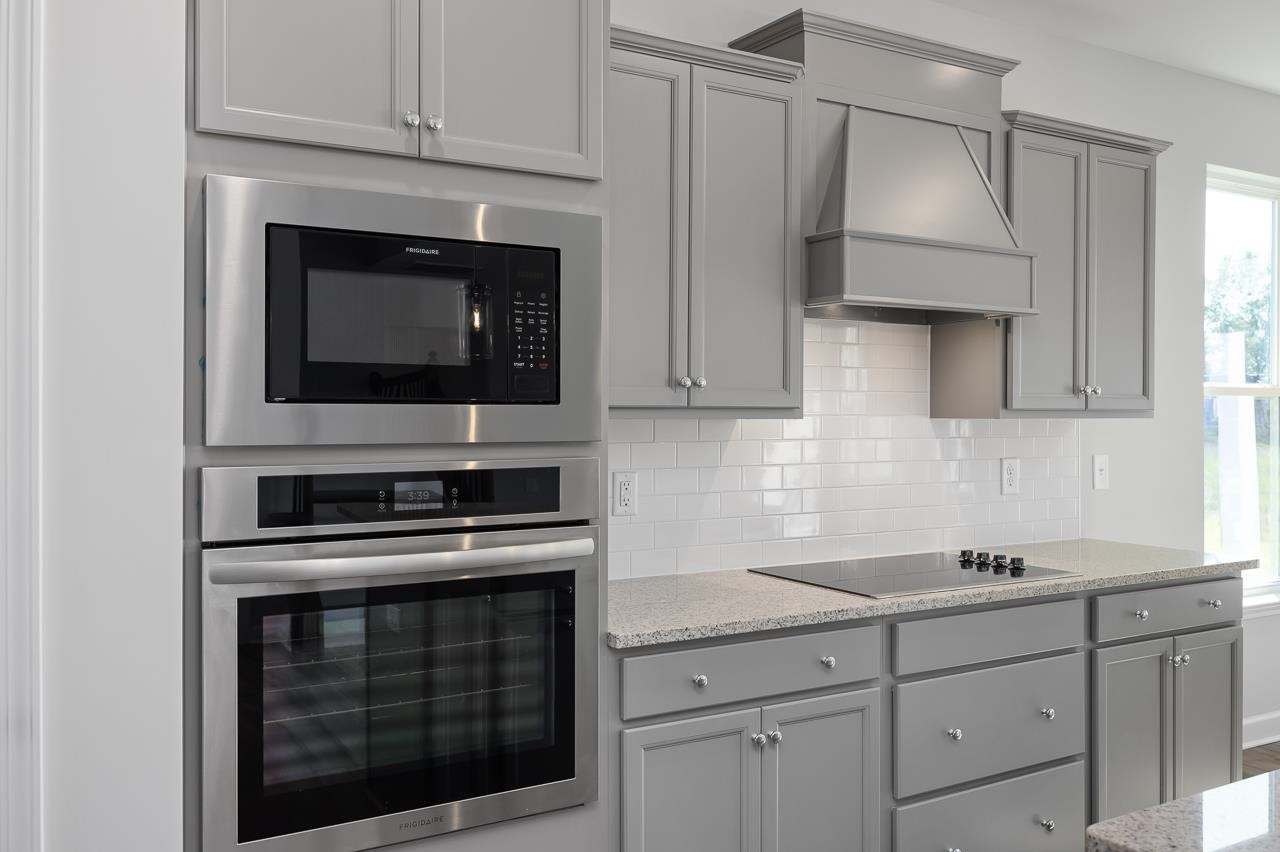 82 Morningside Lane Angier, NC 27501 - Photo 9 of 28 a kitchen with cabinets stainless steel appliances and a sink