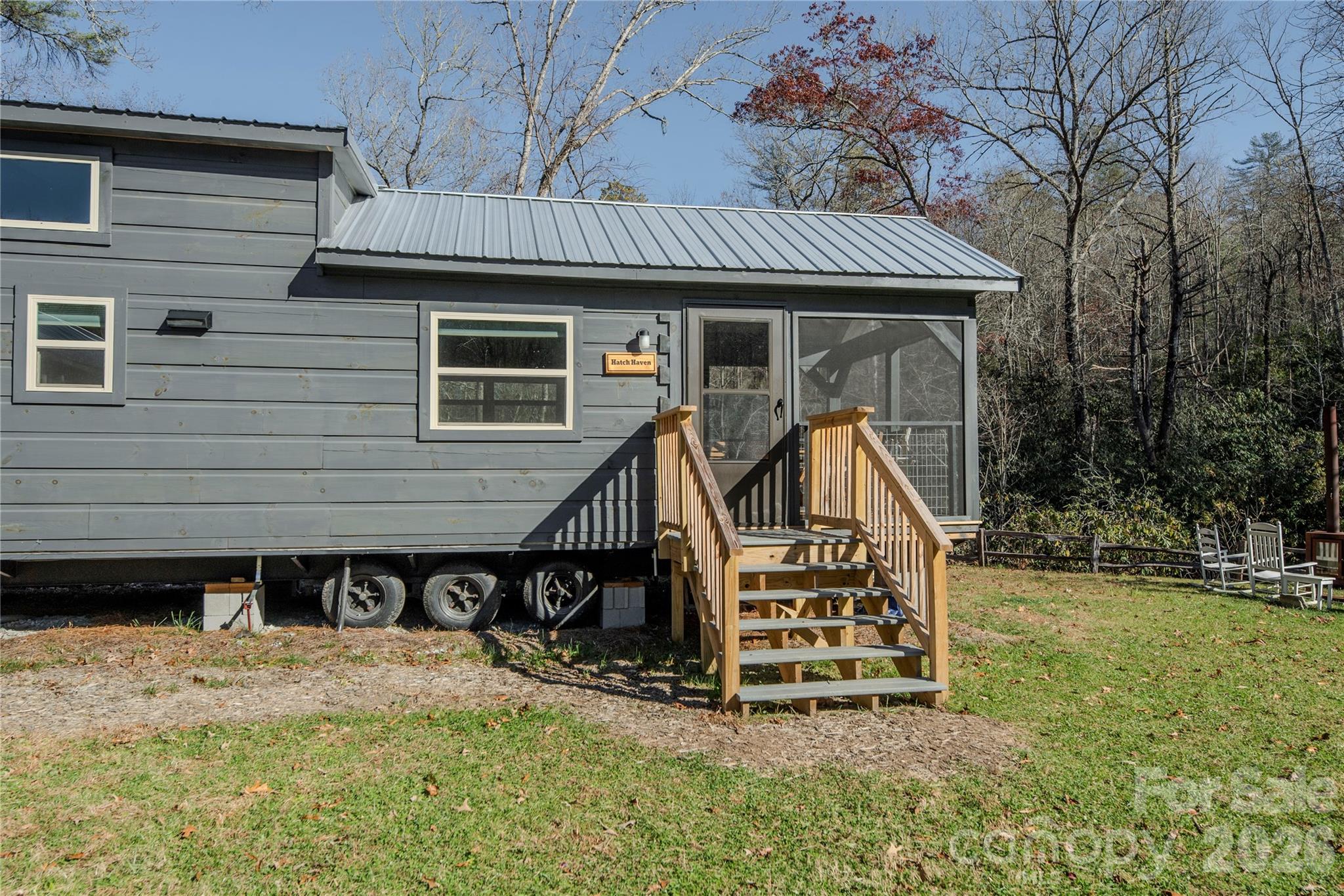 9017 East Fork Road Rosman, NC 28772 - Photo 8 of 39 a view of a wooden house with a yard