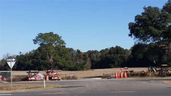 a view of street with parked cars