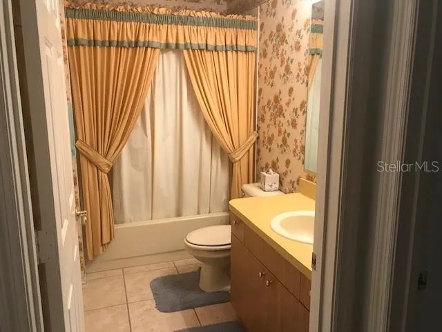 a view of a chairs and table in a patio