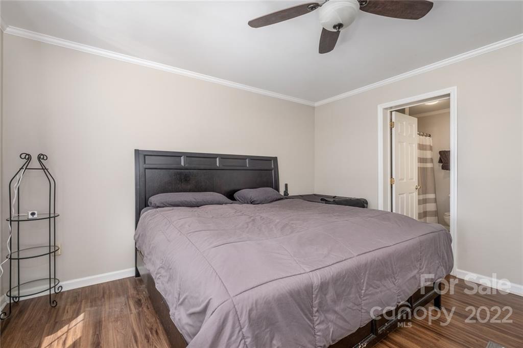 3914 Kiser Island Road Terrell, NC 28682 - Photo 12 of 21 a bedroom with a bed and wooden floor
