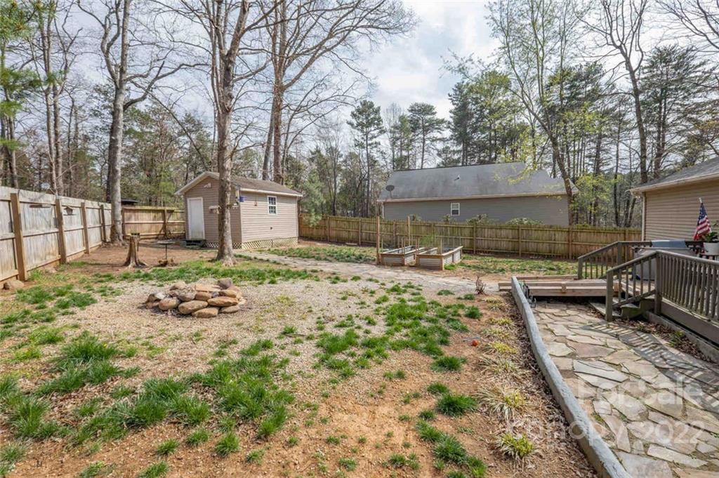 3914 Kiser Island Road Terrell, NC 28682 - Photo 18 of 21 a backyard of a house with barbeque oven and outdoor seating