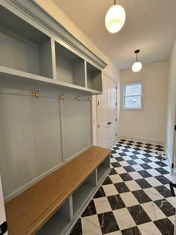 a view of a room with a black and white checkered floor