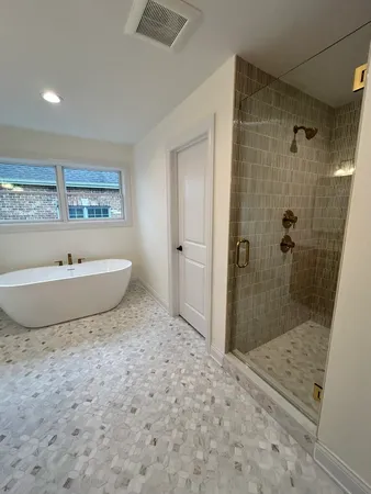 a view of a bathroom with a sink and a shower