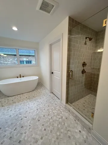 a view of a bathroom with a sink and a shower