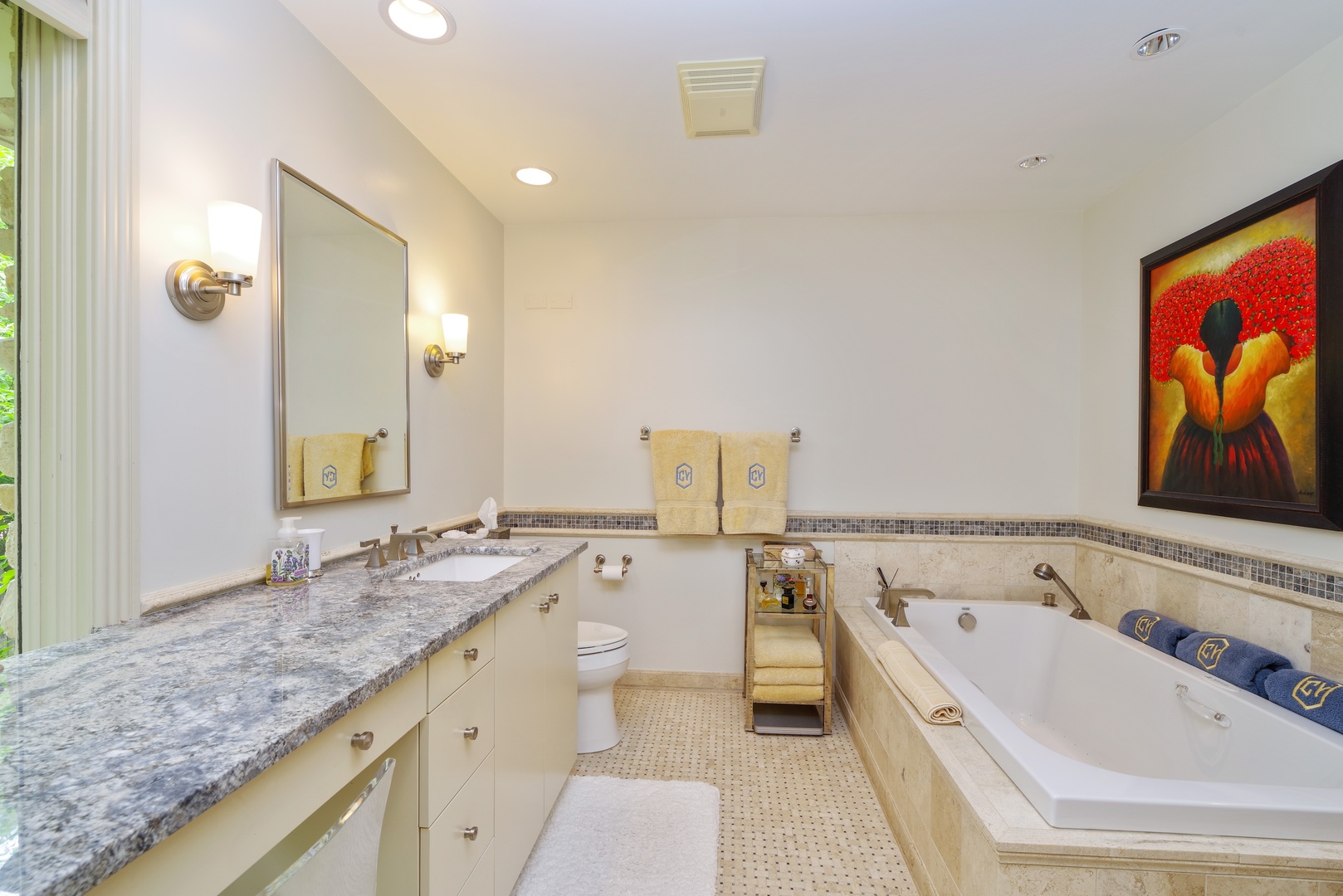 129 Beach Road Glencoe, IL 60022 - Photo 7 of 10 a spacious bathroom with a granite countertop tub sink and mirror