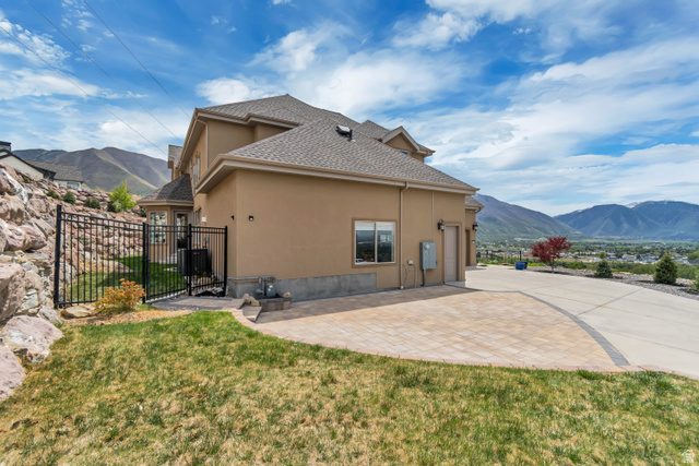 2543 East 700 South Springville, UT 84663 - Photo 7 of 73 Rear view of house with a mountain view, stucco siding, roof with shingles, and a patio area
